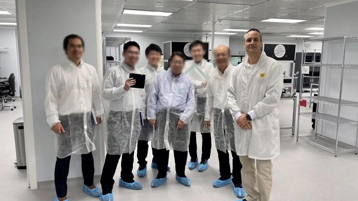 Eyal Yavets with visitors in the company cleanroom