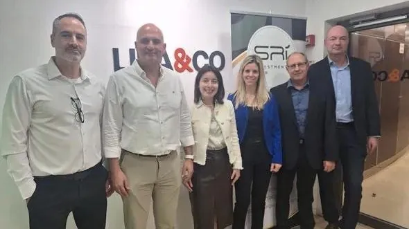 Eyal Yavets with the hosts and speakers of the investor event